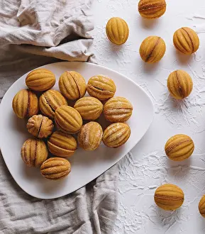Bakery Products Images Drucke: Top view of walnut-shaped cookies on a white table setting
