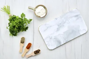 Top View Concept Drucke: Top view of white table with marble serving plate and spice