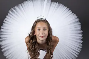 Young Ballerina Drucke: Top view of young ballerina posing looking at camera