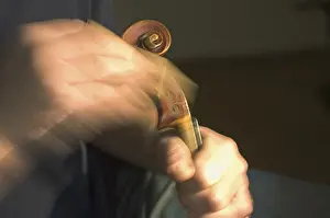 Handicraft Woodwork Drucke: Violin maker is working at the scroll of a violin