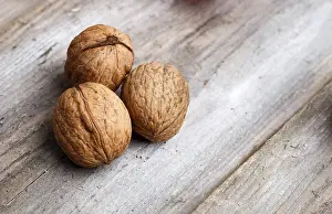 Walnut Close Up Drucke: Walnuts on rustic wooden background with copy space