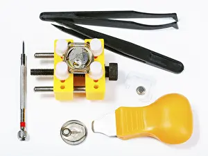 Watchmaker Workshop Drucke: Watchmaker workshop top view of tool kit for changing batteries in the watch on white background