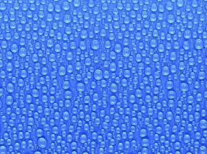 Blue Surface Drucke: Many water drops on a blue surface