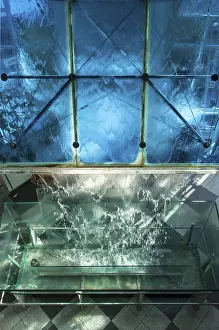 Deserted Waterfront Area Drucke: Water flows over glass surface