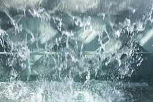 Deserted Waterfront Area Drucke: Water flows over glass surface