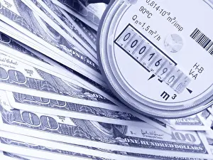 Means Of Payment Transaction Drucke: A water meter on a heap of US 100 dollar notes