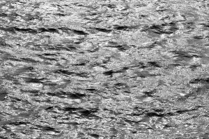 Europe Travel Photography Image Drucke: Water surface with waves and light reflections