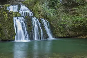 Waterfall In France Drucke: Waterfall from the source of the Lison in a haven of tranquillity with its waterfall surrounded by woods