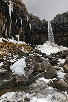 Waterfall In Winter Drucke: Waterfall, stream, basalt columns