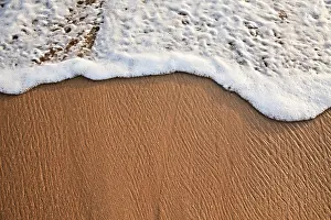 Uninhabited Coastline Scene Drucke: Wave surging on sand on beach