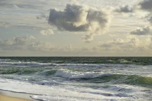 Coastal Area In Europe Drucke: Waves on the beach, cloudy sky