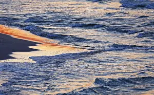 Evening Atmosphere On The Coast Drucke: Waves on the beach in the evening light