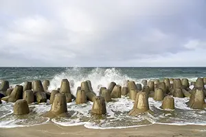 North Sea Beaches Drucke: Waves break at concrete breakwaters