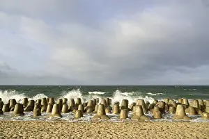 North German Coast Drucke: Waves break at concrete breakwaters