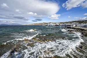 Mediterranean Beach Scene Drucke: Waves breaking between the rocks on the beach