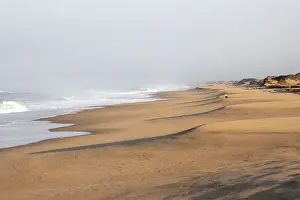 Deserted Sandy Beaches Africa Drucke: Waves burn on the Atlantic coast