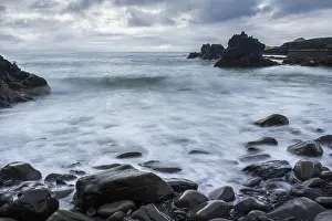Icelandic Natural Preserves Drucke: Waves clashing at the stony beach at Hellnar
