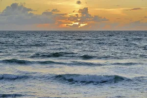 North Sea Sunset Drucke: Waves running out on the beach at sunset
