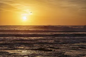 Deserted Beach Evening Drucke: Waves at sunset on the Atlantic Ocean