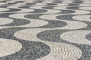 Lisbon Street Photography Drucke: Wavy pattern in pavement, black and white