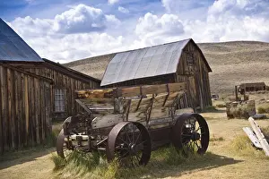 California Ghost Towns Drucke: Weathered rustic wagon and barn at an old west ghost town