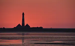 Red And White Lighthouse Tower Drucke: Westerheversand lighthouse after sunset, Germany