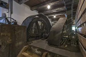 Eco Friendly Energy Source Drucke: Wheels of a grain mill driven by water power