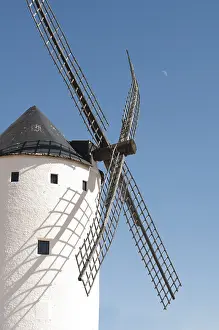 Rural Countryside Scene Drucke: White ancient windmill. Blue sky background
