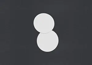 Business Card Template Design Drucke: Two white circular sheets overlapping on a dark background
