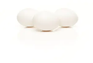 Plain Background Photos Drucke: Three white eggs isolated on a white background