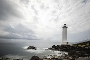 French Overseas Territory Scenery Drucke: White lighthouse on a steep coast