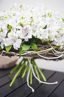 Peru Travel Photography Drucke: White Lily of the Incas in a bunch on rustic background with copyspace