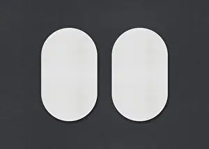 Business Card Design Ideas Drucke: Two white oval sheets side by side on a gray background
