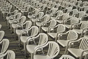 Urban Environment Southern Germany Drucke: White plastic chairs arranged in rows