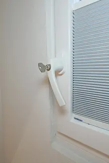Central European Building Sites Drucke: Detail of a white window handle with integrated blind