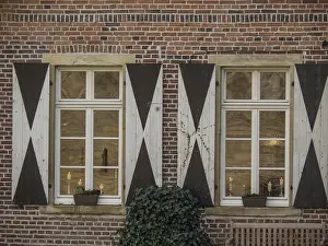 Central Europe Brick Buildings Drucke: Two whitewashed windows with shutters on a brick wall