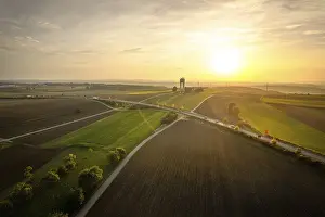 Evening Atmosphere In The Black Forest Drucke: Wide fields at sunset with a road network