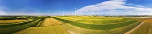 Alternative Energy Source Europe Drucke: Wind farm between grainfields, panorama