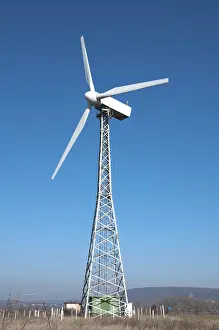 Green Energy Production Drucke: Wind generators on blue sky