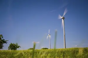 Regenerative Energy Production Drucke: Wind generators turbines at sunset