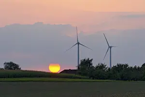 Ecofriendly Energy Source Germany Drucke: Wind turbines in front of setting sun