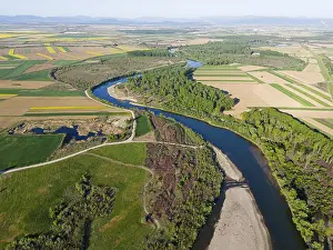 View From Above Agricultural Land Drucke: A winding river, bordered by forests and fields