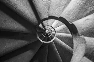 Deserted Building Entrance Drucke: Winding and spiralling concrete staircase in a tower