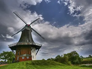 Nature Photography Germany Drucke: A windmill in front of a dramatic sky