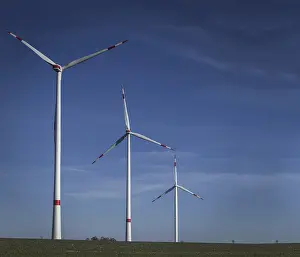 Empty Farm Fields Drucke: Windmill in the field, three windmills with cleared sky