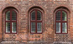 Clinker Construction Germany Drucke: Three windows on an old brick house