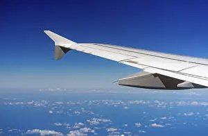 Deserted City Skyline Drucke: Wing of an airplane, view from window