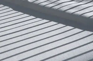 Daytime Winter Landscape Photo Drucke: Winter impression, fence casting a shadow on snow