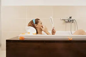 Personal Hygiene Care Drucke: Woman checking her expression lines while bathing