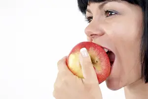 Balanced Diet For Women Drucke: Woman eats apple